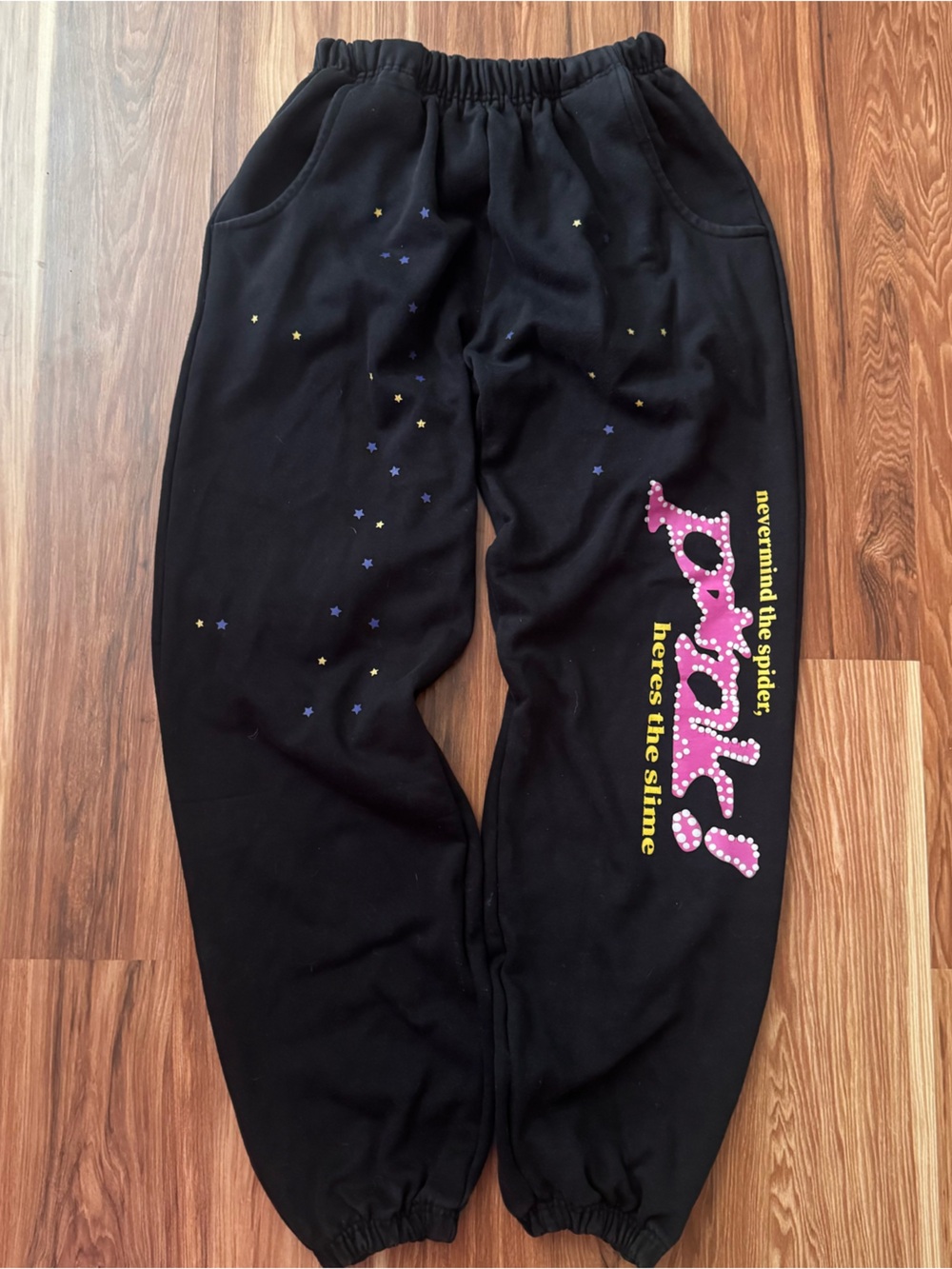 Sp5dr Black Graphic Jogger Pants with Pink & Yellow Print